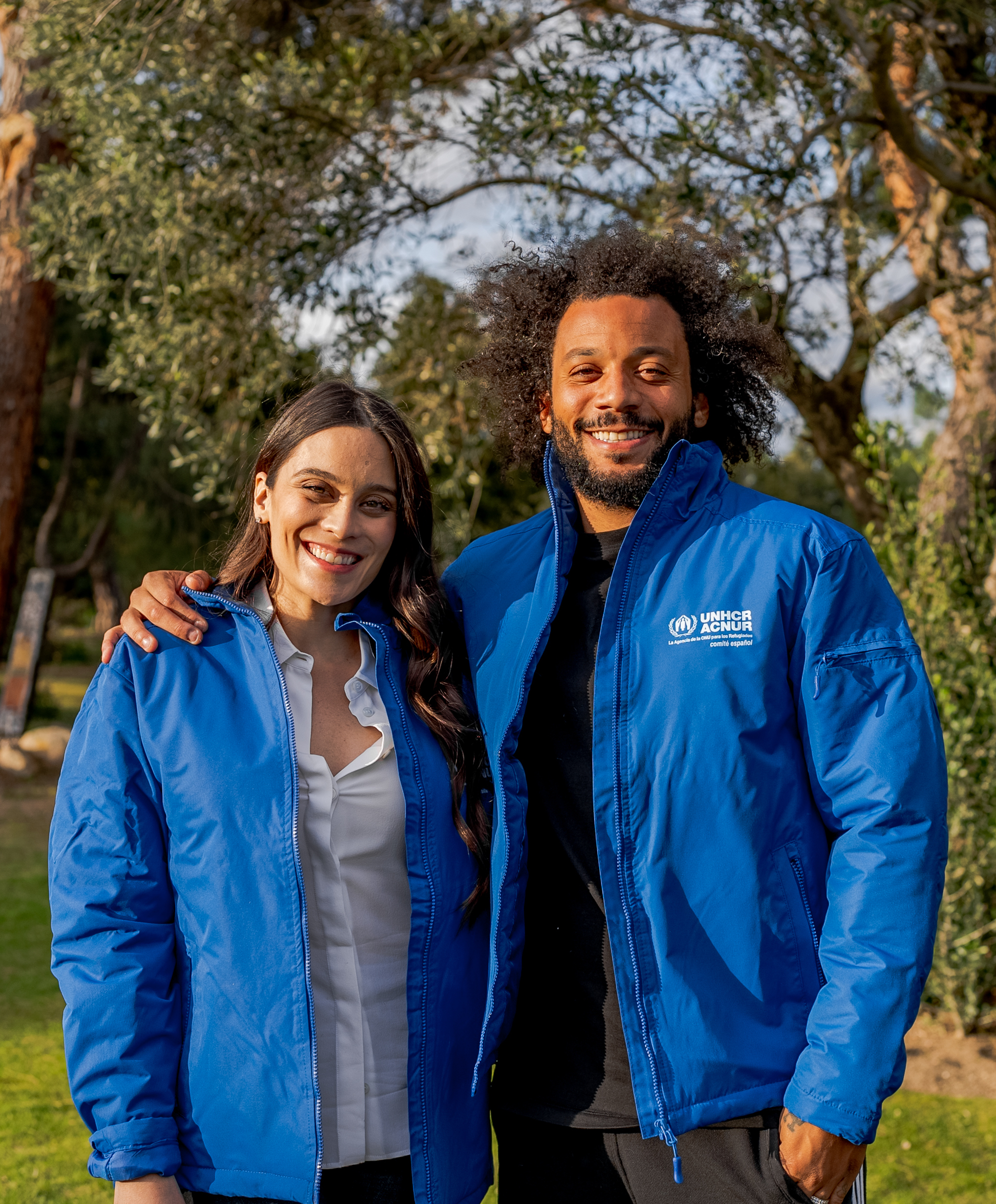 Marcelo and Clarice wearing UNHCR jackets