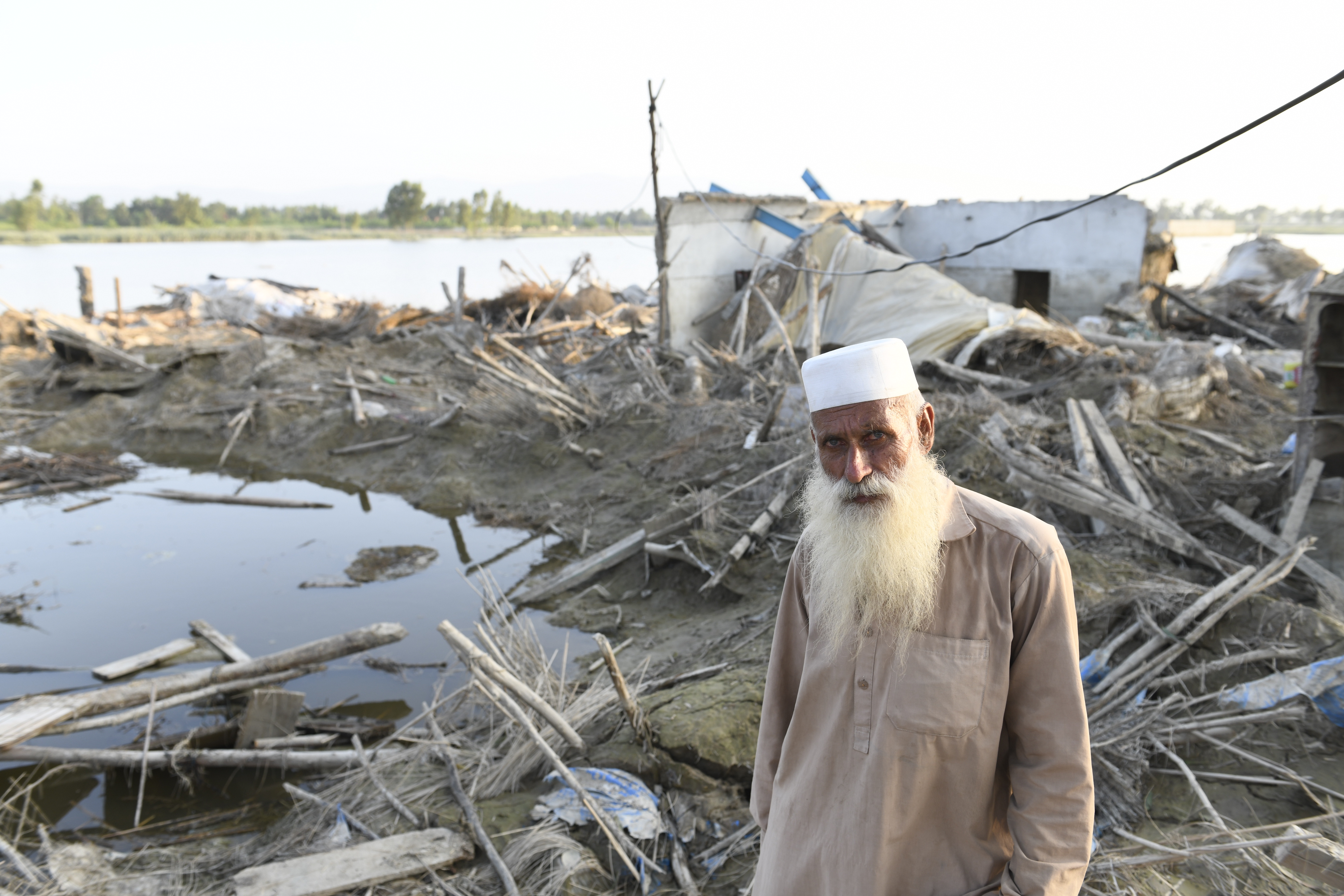 UNHCR: Pakistan emergency Afghan refugee Bahadur, 60, takes shelter in a UNHCR tent after being displaced by the monsoon flooding in Nowshera District