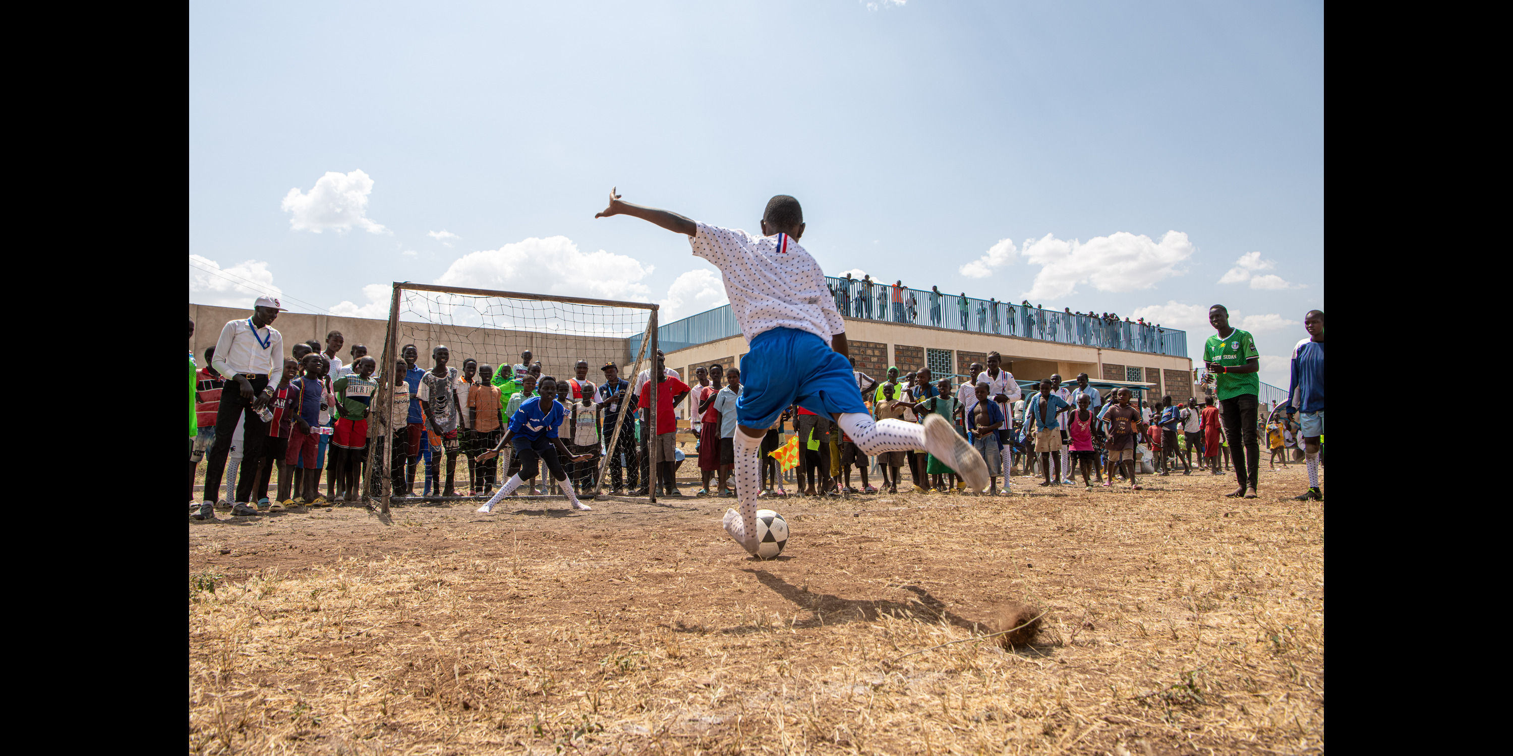 A kid takes the winning penalty for her school festival