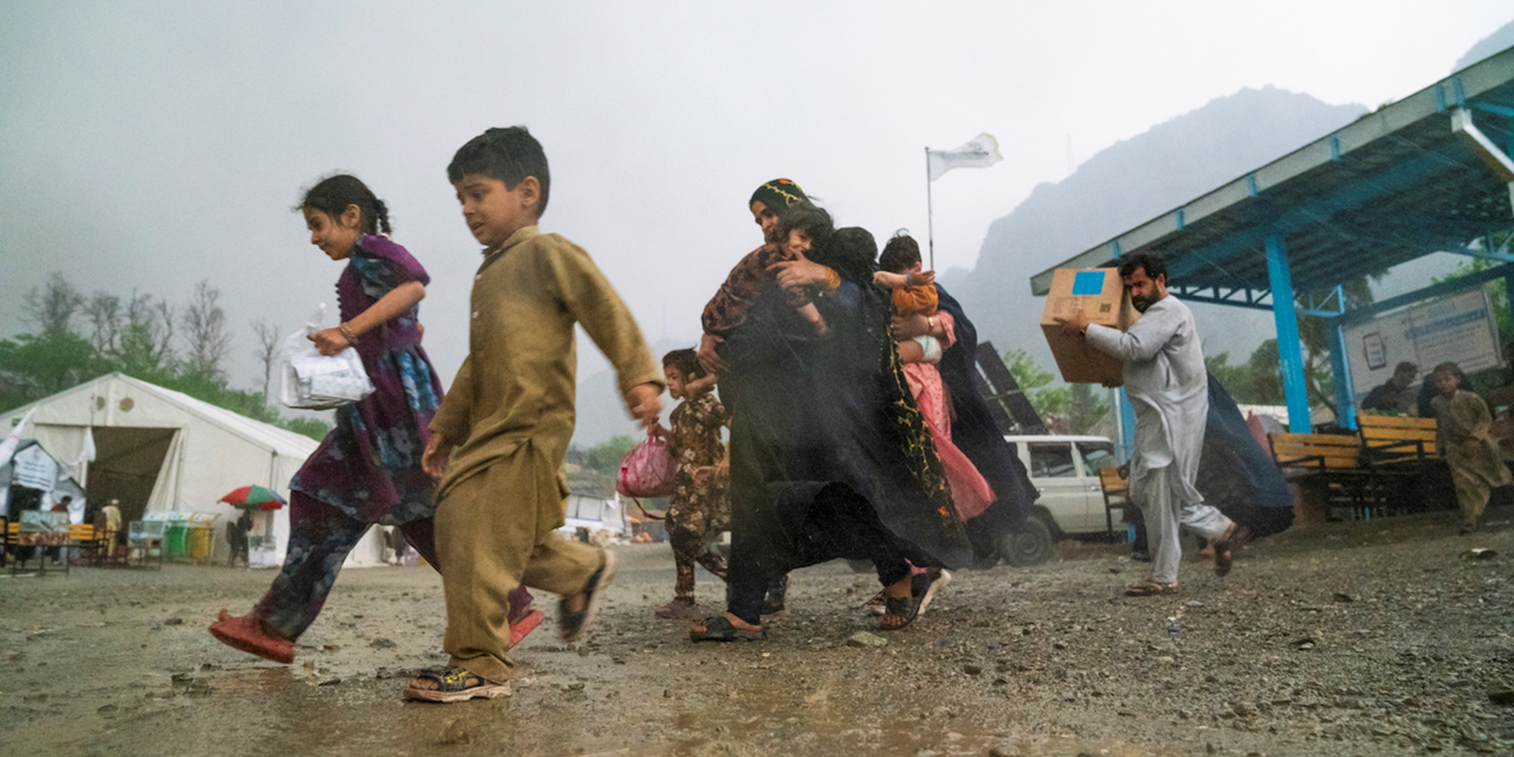 A Humanitarian Crisis Demands Urgent Action: Help Returning Afghans afghan children and families at the Torkham border area receive assistance from UNHCR including emergency cash for food and essential items.