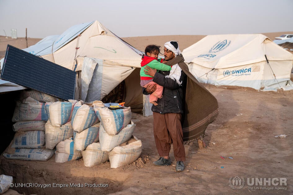 UNHCR: Afghanistan Earthquake A man with his daughter Infront of UNHCR tents