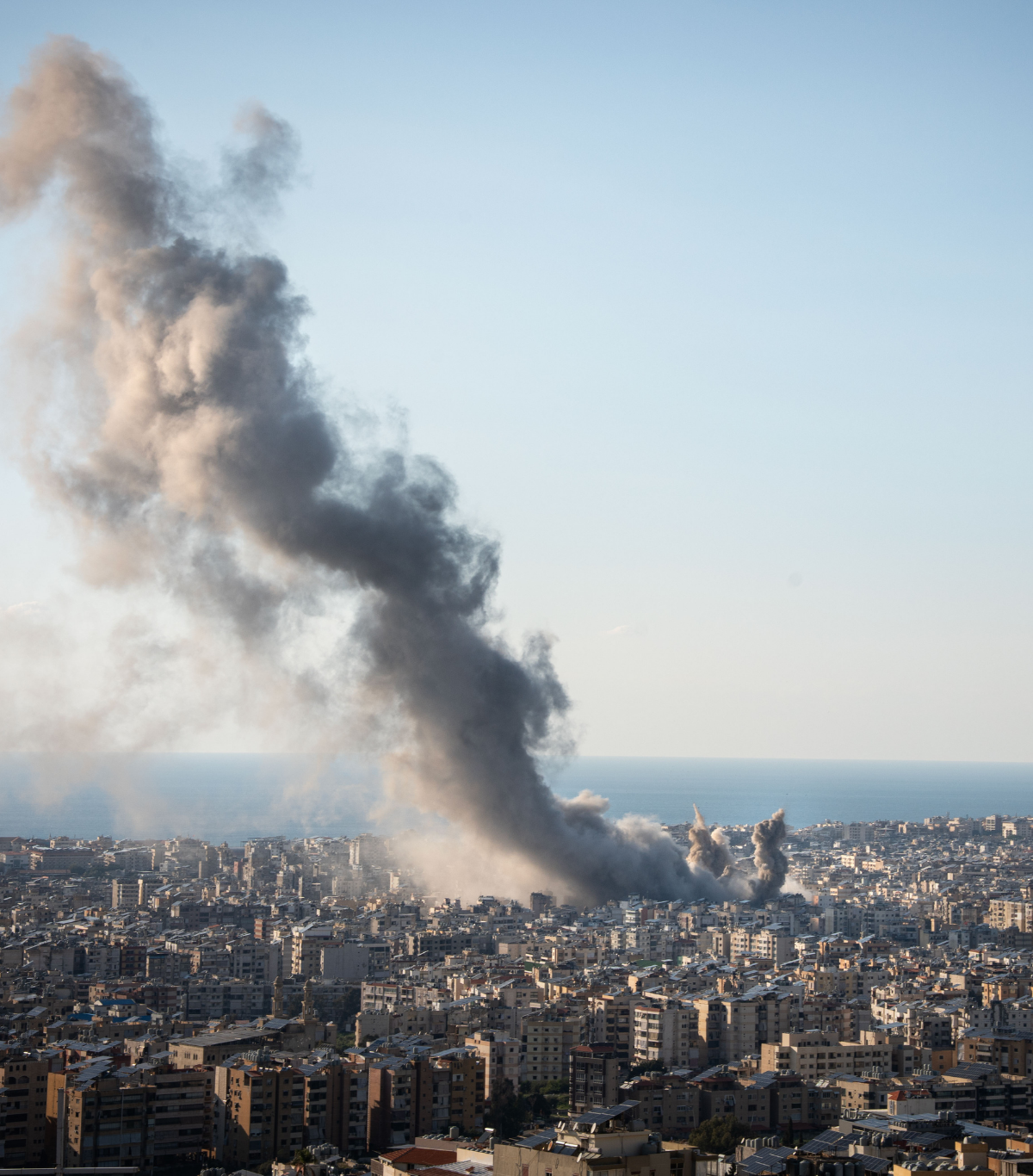 Civilians gather in an area affected by conflict and displacement in Beirut, Lebanon.