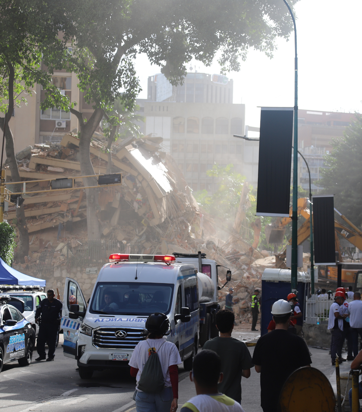 Damaged buildings and debris following earthquakes in Venezuela.