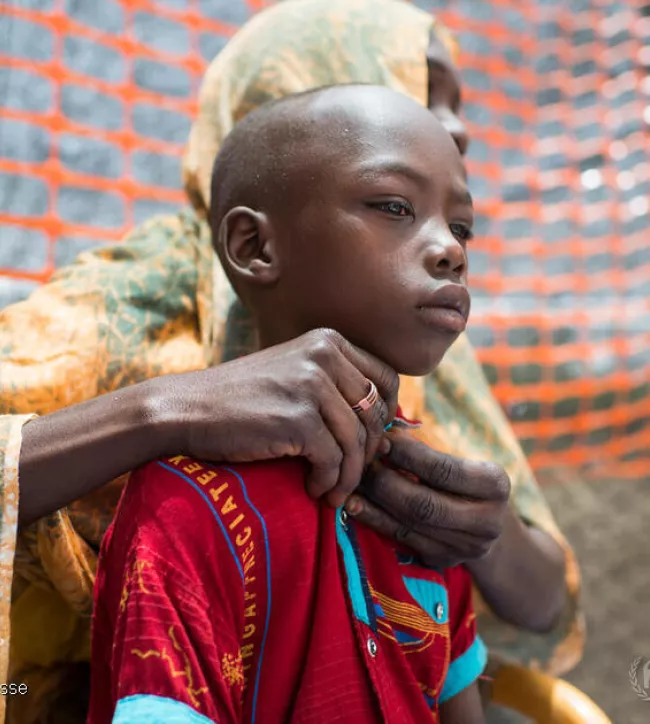 refugee child and his mother from Sudan, Tchad, 2023
