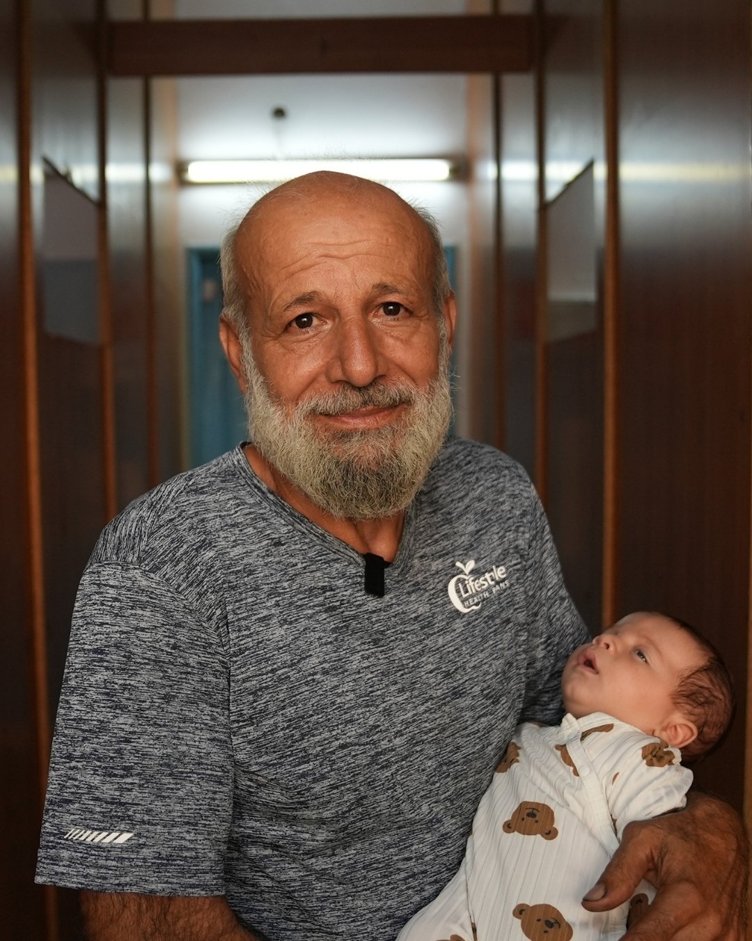 Ali Trad Displaced Lebanese grandfather Ali Trad with his grandson Adam at a collective shelter in Beirut, Lebanon. Ali fled his hometown in Maarake, south Lebanon, following the intensification of Israeli bombings in the country since 23 September 2024.