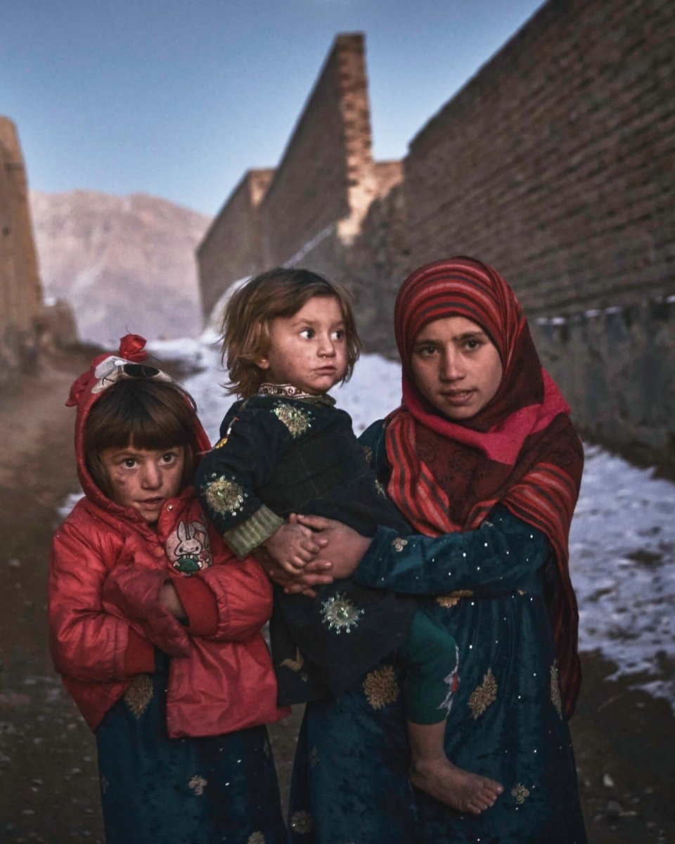 Refugees in Afghanistan, seeking shelter from the cold.