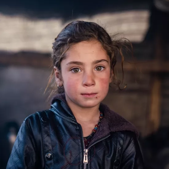 Sherin, 7, lives with her family in a tent. She dreams of a better life and a future free from struggles.