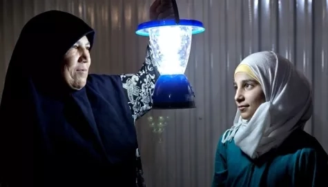 Refugees Holding Light Buld