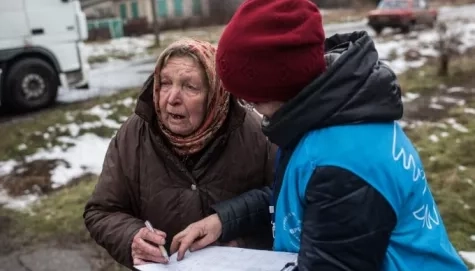 Ukraine. UNHCR delivers coal to village on the frontline.