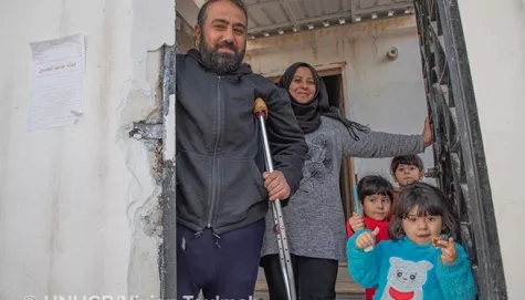 Syria. UNHCR supports resilient father to make family home habitable.
